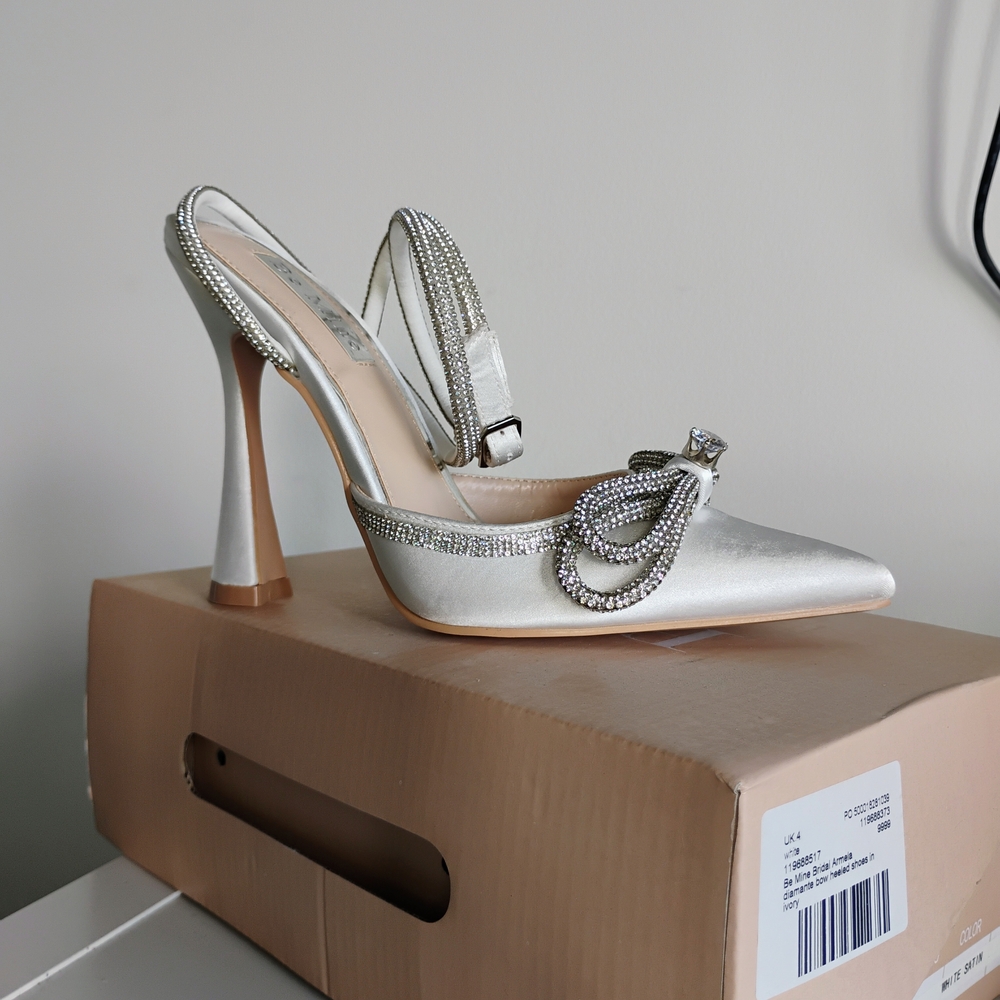 Chic White Satin Heels with Rhinestone And Bow Details.